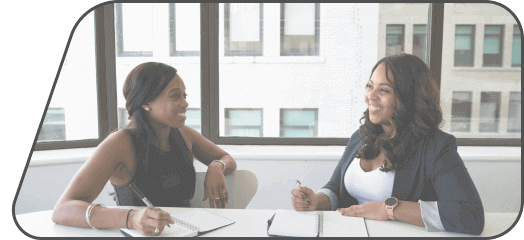 two woman talking happy after securing a bad credit personal loan